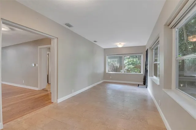 a view of a roof deck with wooden floor and fence