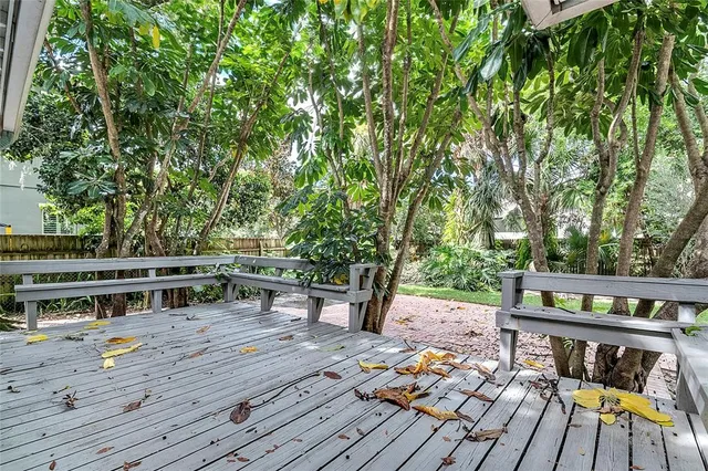 a kitchen with refrigerator and cabinets