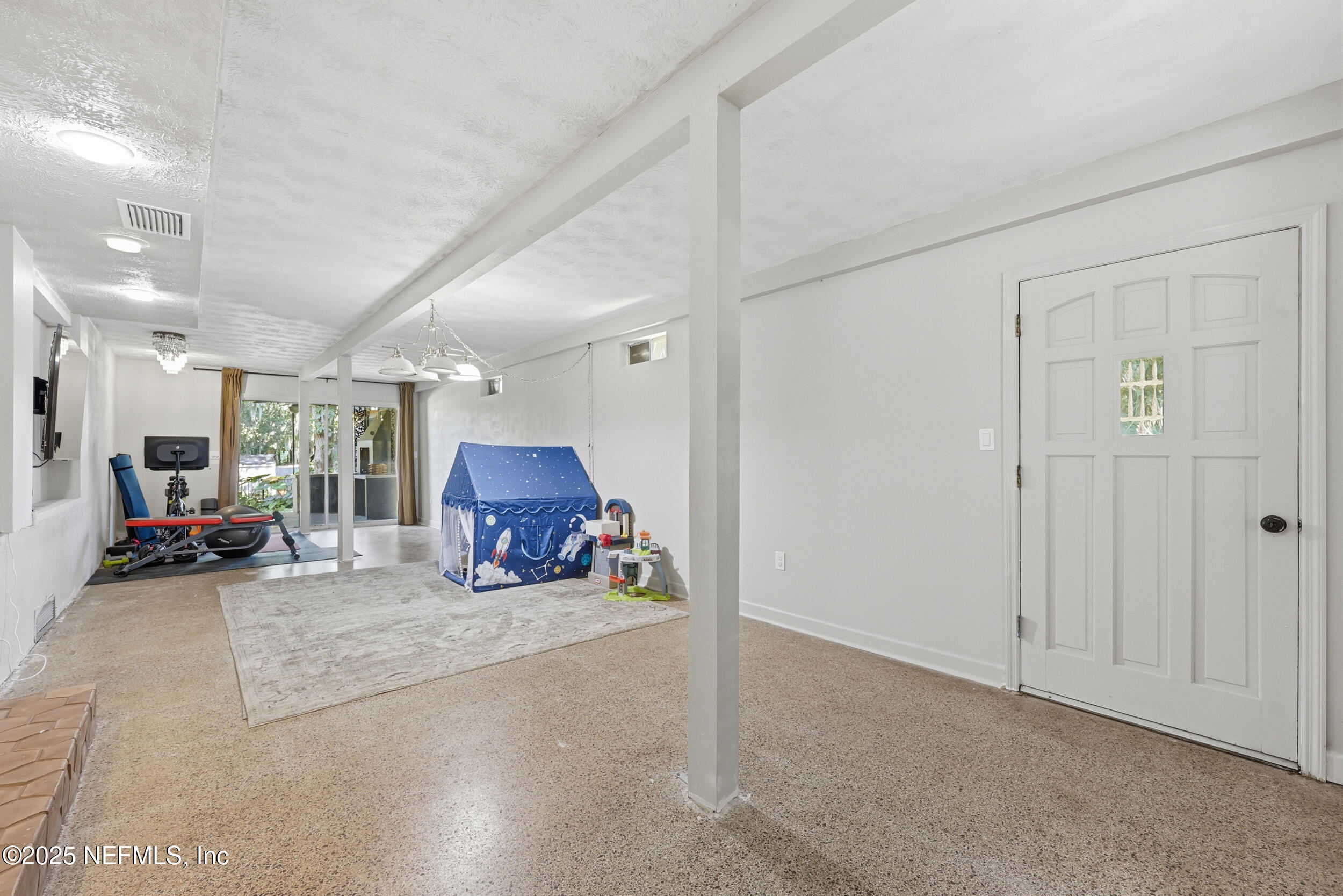 1315 Mayfair Road Jacksonville, FL 32207 - Photo 23 of 48 a living room with furniture and a large window