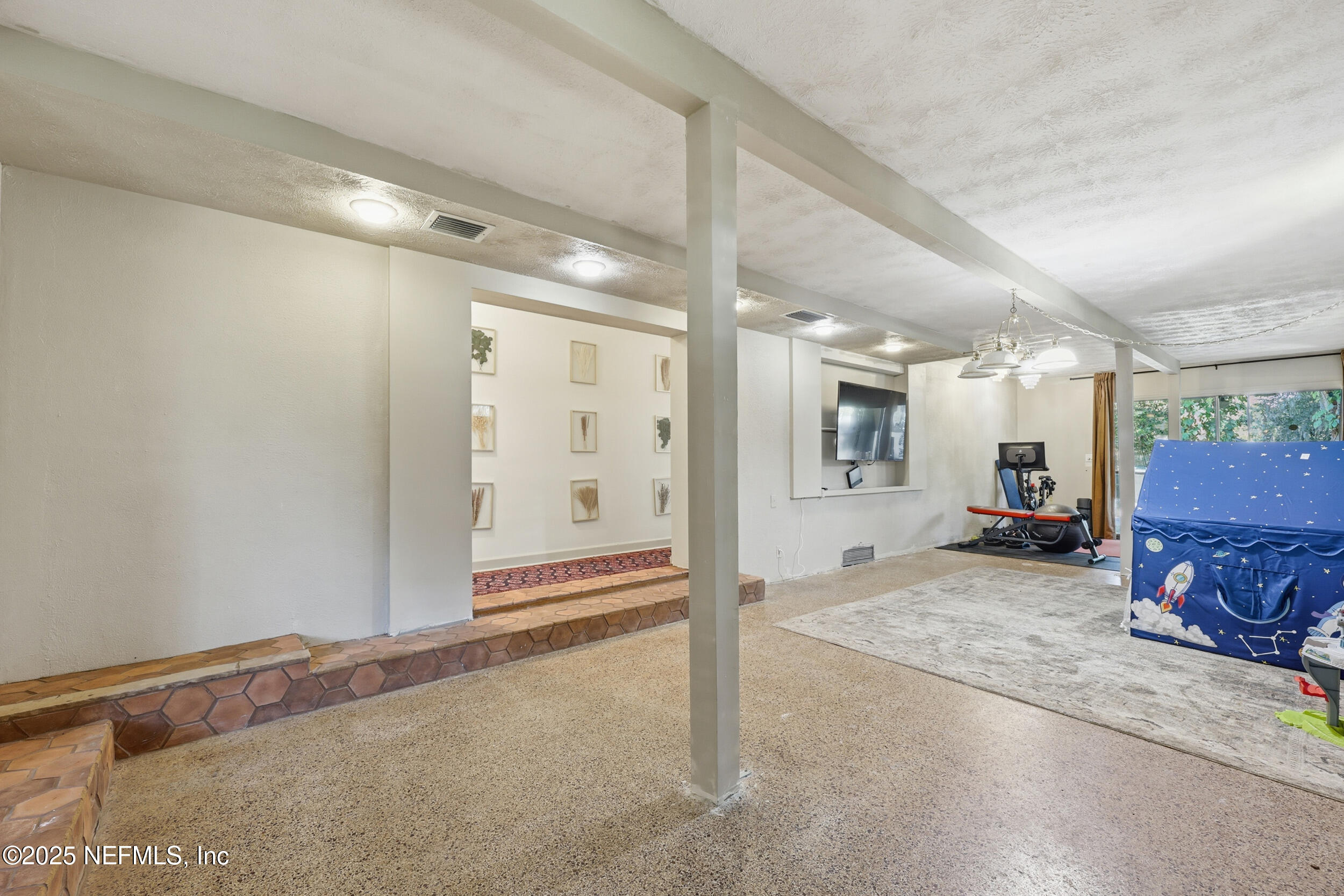 1315 Mayfair Road Jacksonville, FL 32207 - Photo 24 of 48 a view of a hallway with wooden floor and a fireplace