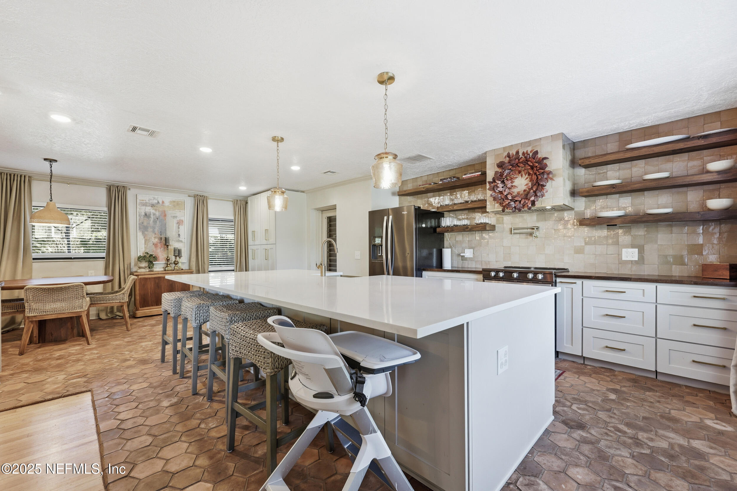 1315 Mayfair Road Jacksonville, FL 32207 - Photo 8 of 48 a large kitchen with a table and chairs
