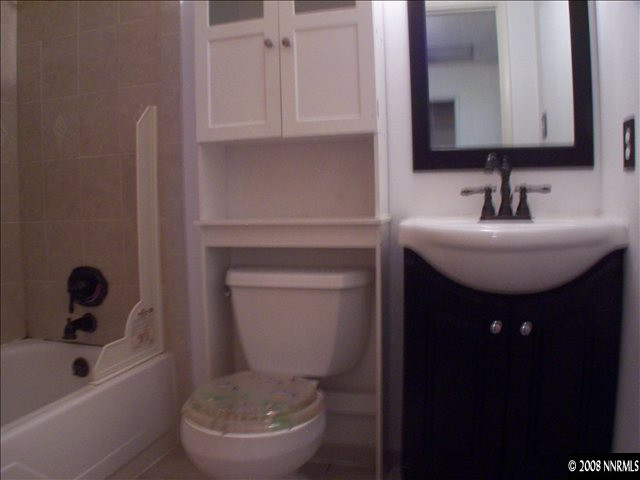 5001 Tahiti Way, Unit 3 Reno, NV 89502 - Photo 4 of 9 a bathroom with a sink a toilet and bathtub