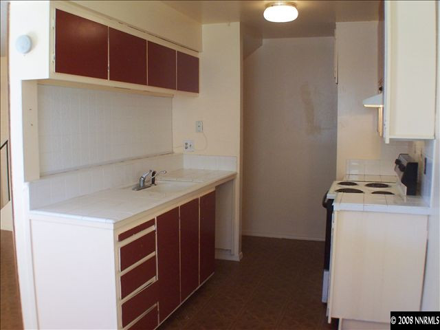 5001 Tahiti Way, Unit 3 Reno, NV 89502 - Photo 7 of 9 a utility room with cabinets washer and dryer
