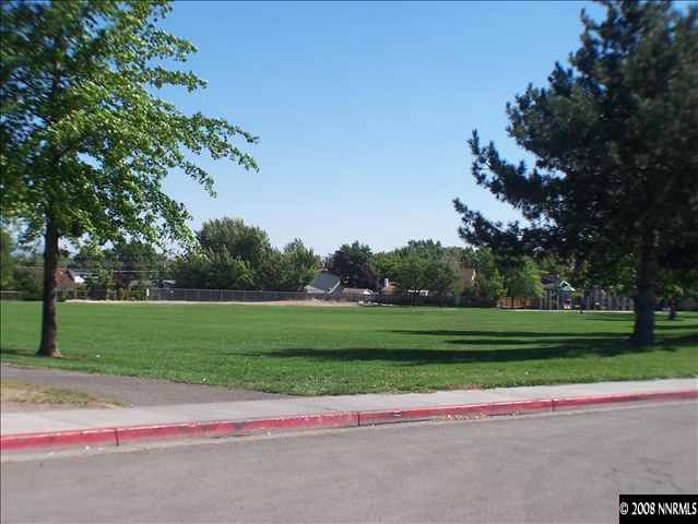 5001 Tahiti Way, Unit 3 Reno, NV 89502 - Photo 9 of 9 a green field with lots of trees in the background