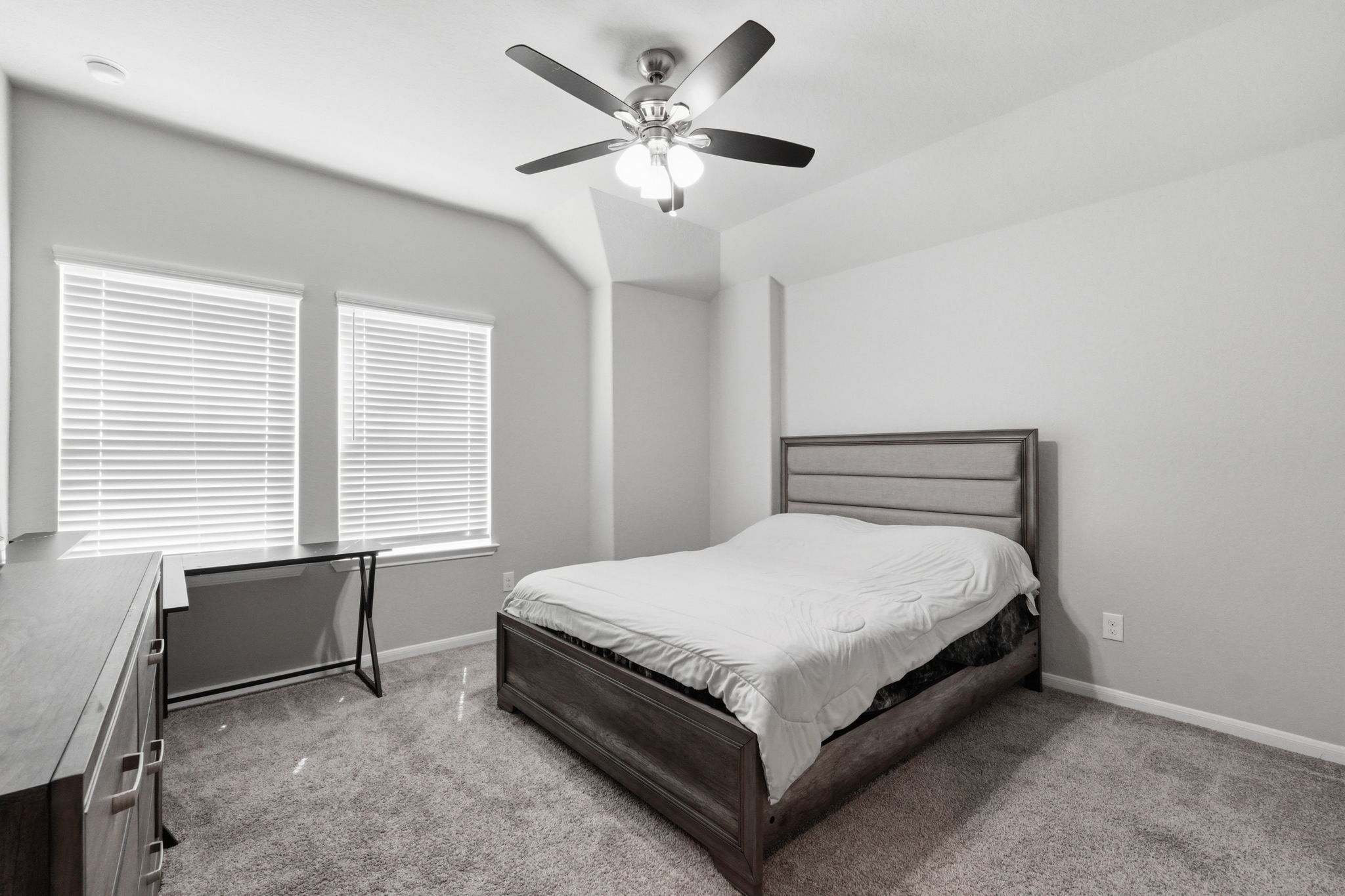 4334 Umber Shadow Drive Spring, TX 77386 - Photo 27 of 45 Secondary bedroom features large windows for natural light, plush carpeting, and a ceiling fan for added comfort.