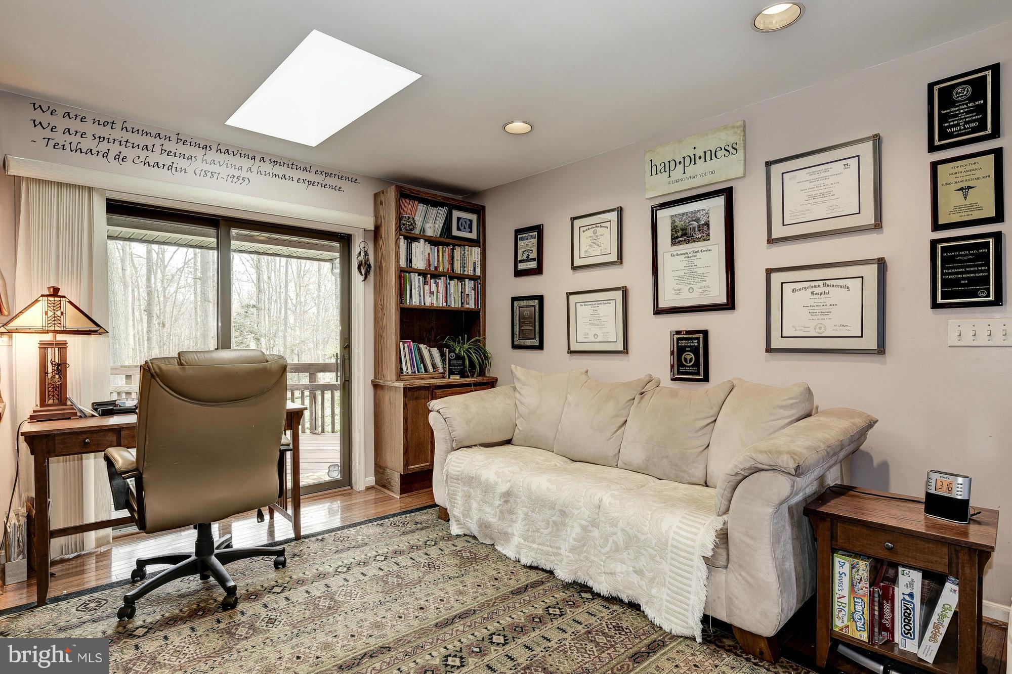 10302 Lloyd Road Potomac, MD 20854 - Photo 13 of 30 a living room with furniture and a window