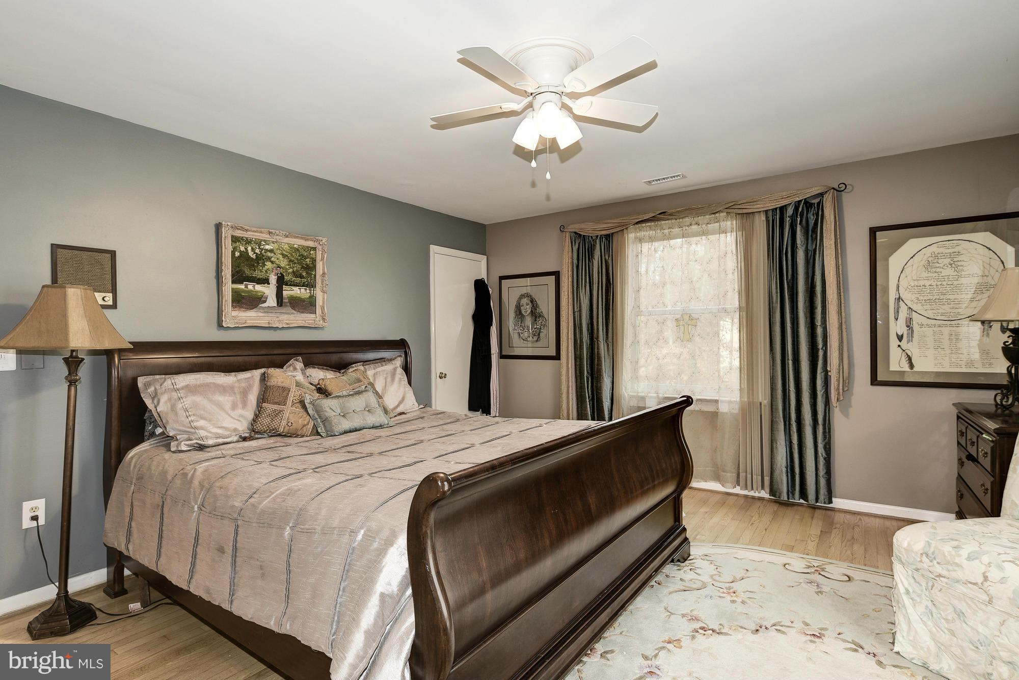 10302 Lloyd Road Potomac, MD 20854 - Photo 16 of 30 a bed room with a bed and a window