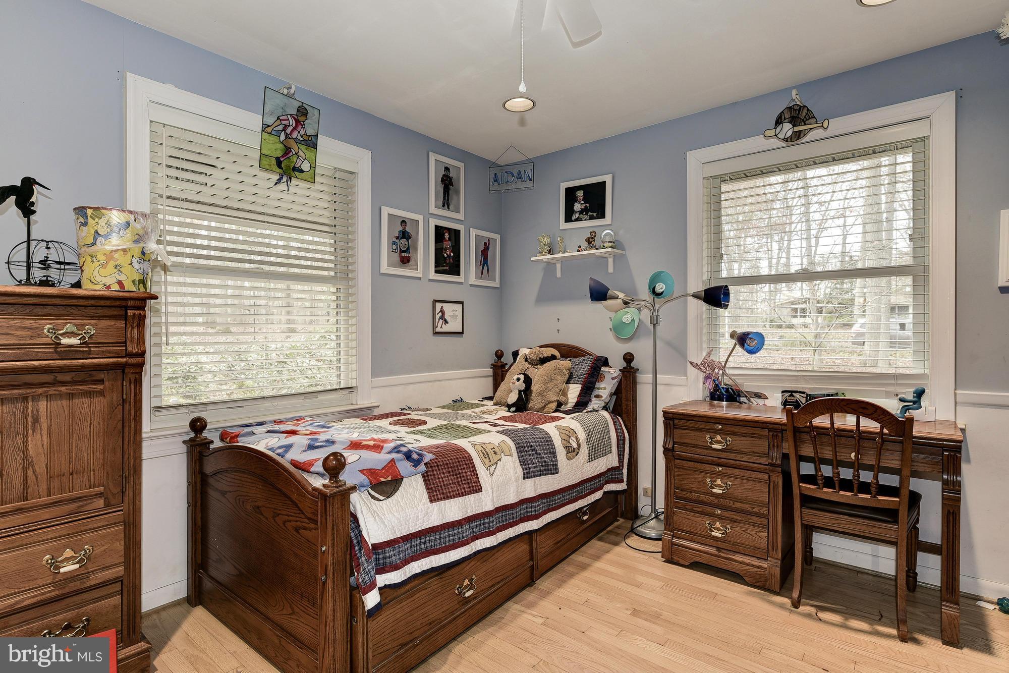 10302 Lloyd Road Potomac, MD 20854 - Photo 18 of 30 a bedroom with a bed and a window