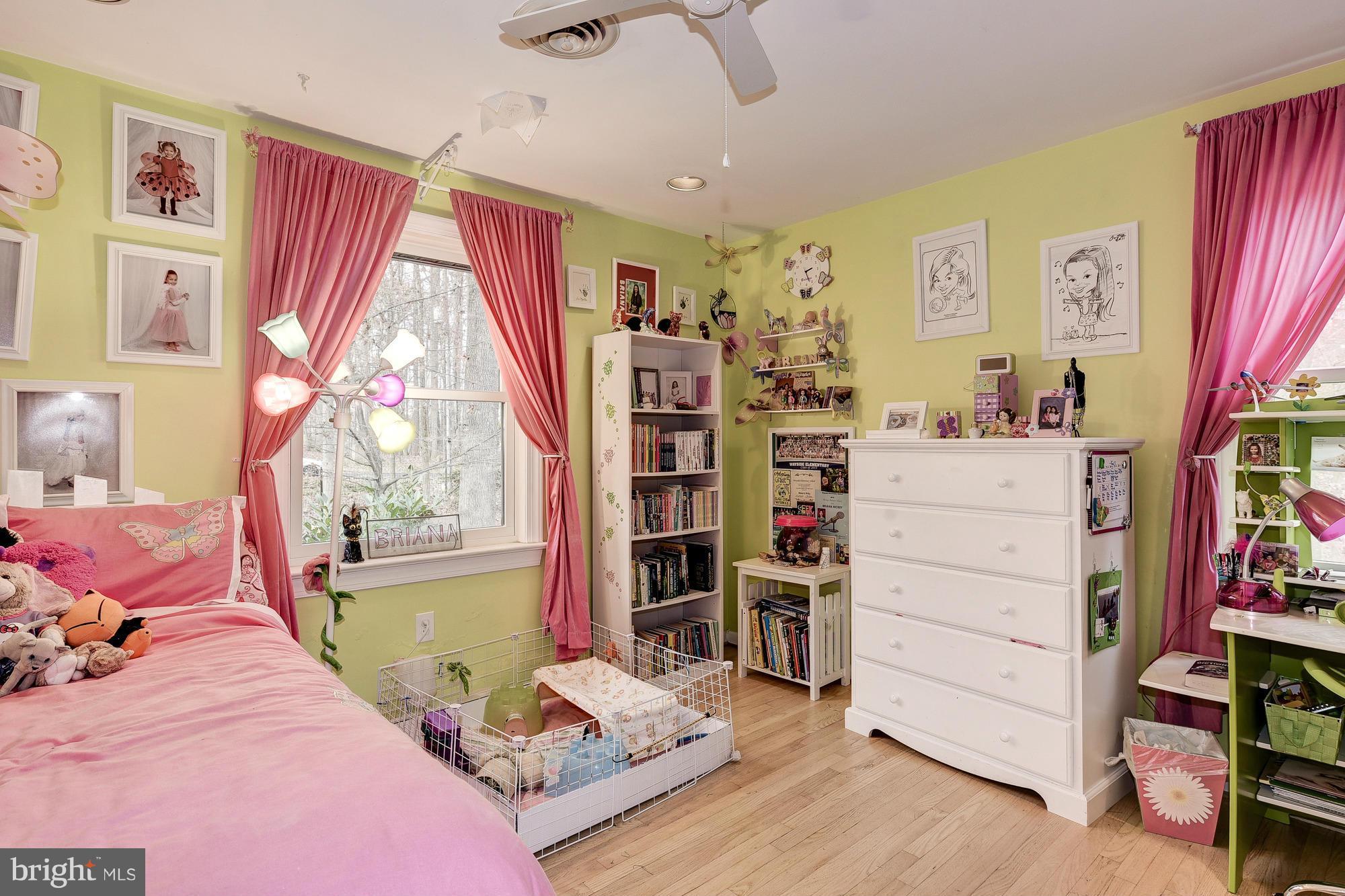 10302 Lloyd Road Potomac, MD 20854 - Photo 19 of 30 a bedroom with a bed and a window