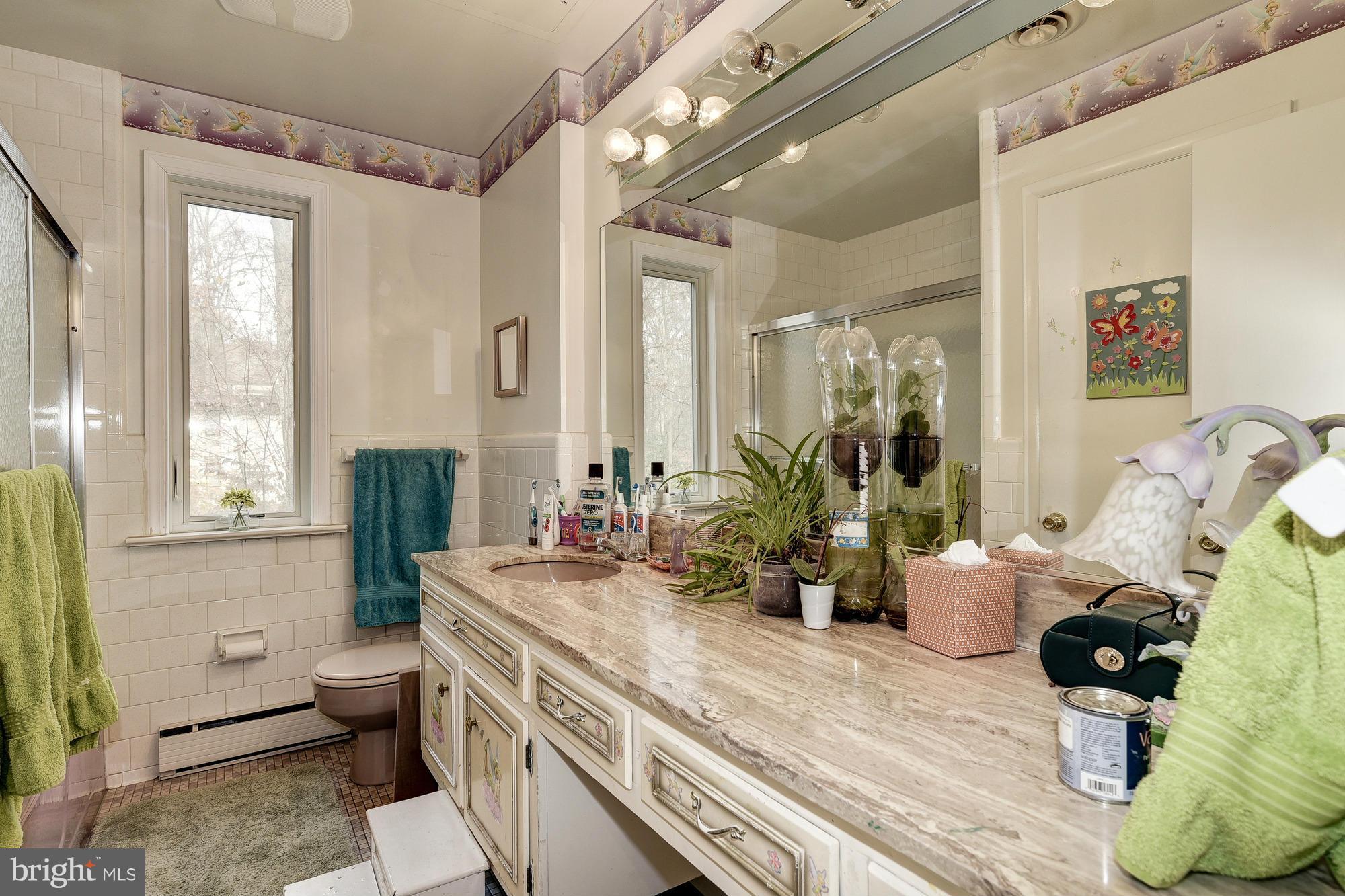 10302 Lloyd Road Potomac, MD 20854 - Photo 20 of 30 a view of bathroom with dual sinks