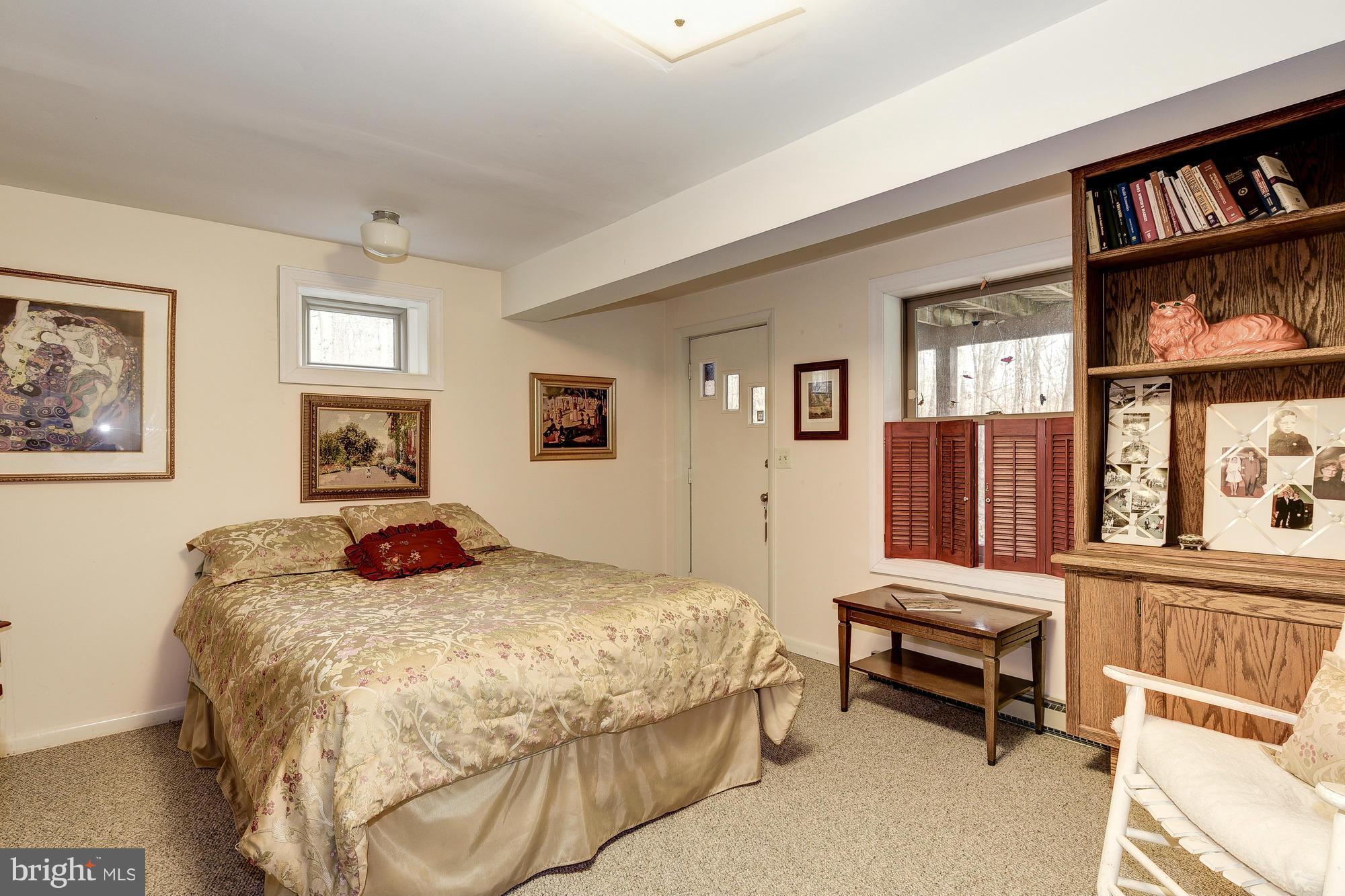 10302 Lloyd Road Potomac, MD 20854 - Photo 24 of 30 a bedroom with a bed and a cabinets
