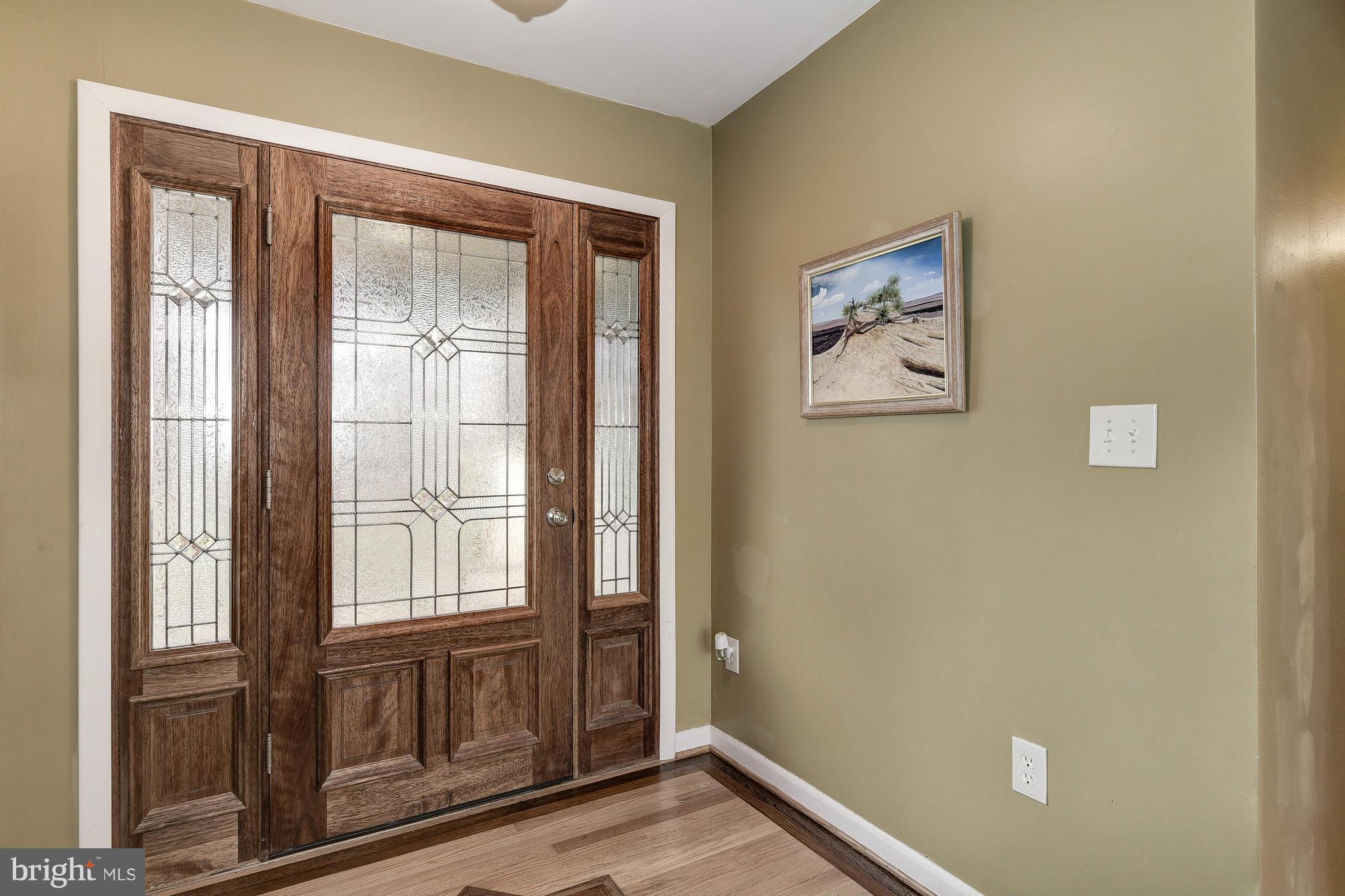 10302 Lloyd Road Potomac, MD 20854 - Photo 4 of 30 wooden floor in an empty room with a window