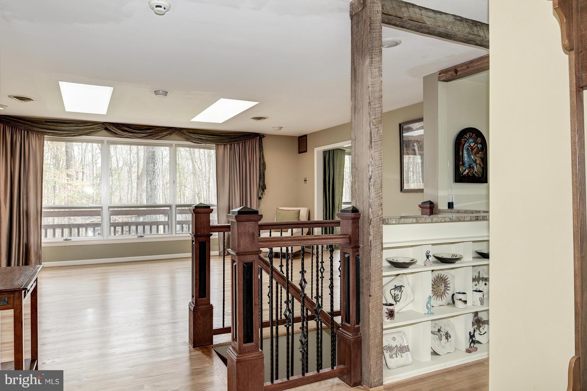 10302 Lloyd Road Potomac, MD 20854 - Photo 5 of 30 a view of a hallway with a large window