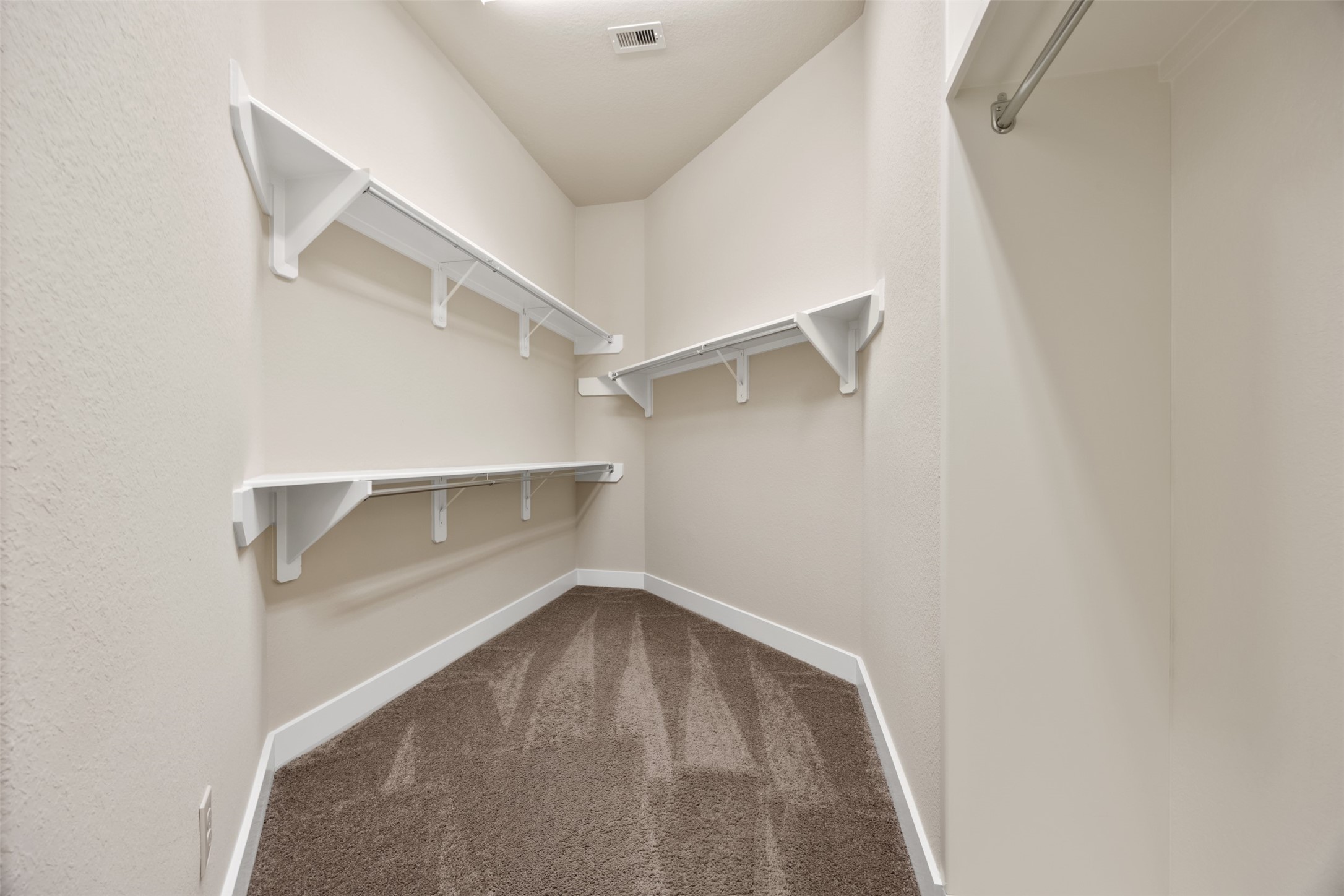 6515 Fraser Point Spring, TX 77379 - Photo 36 of 39 a view of a room with racks on the wall