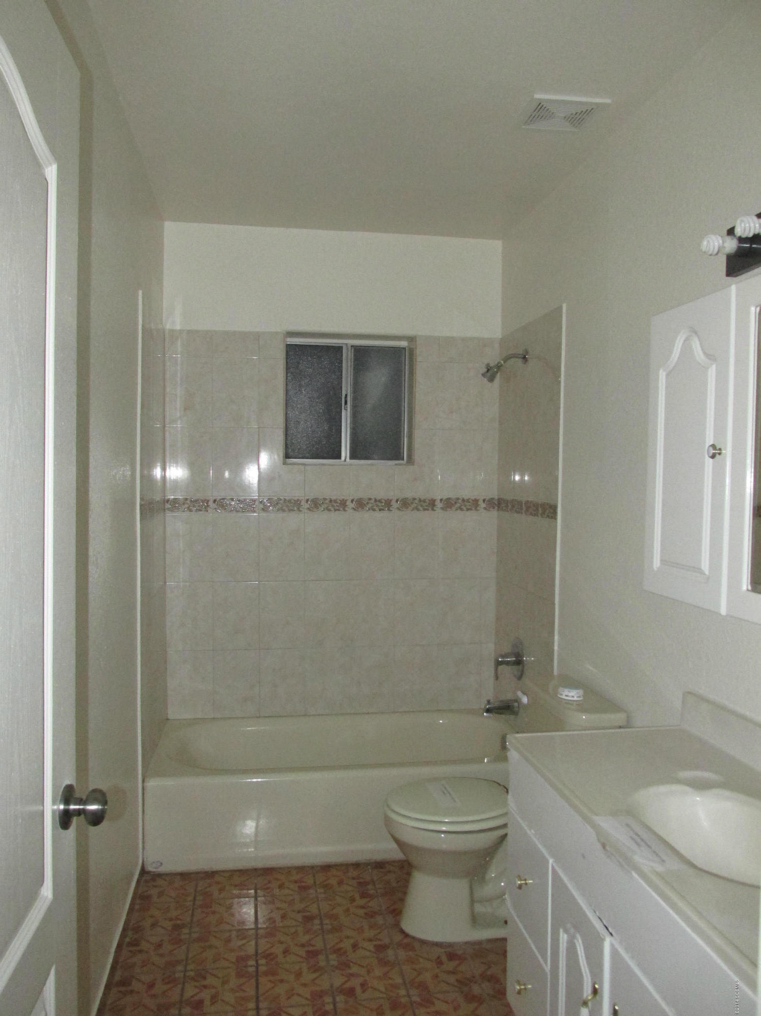 254 Paseo Mascota Rio Rico, AZ 85648 - Photo 6 of 10 a bathroom with a granite countertop toilet a sink and a mirror
