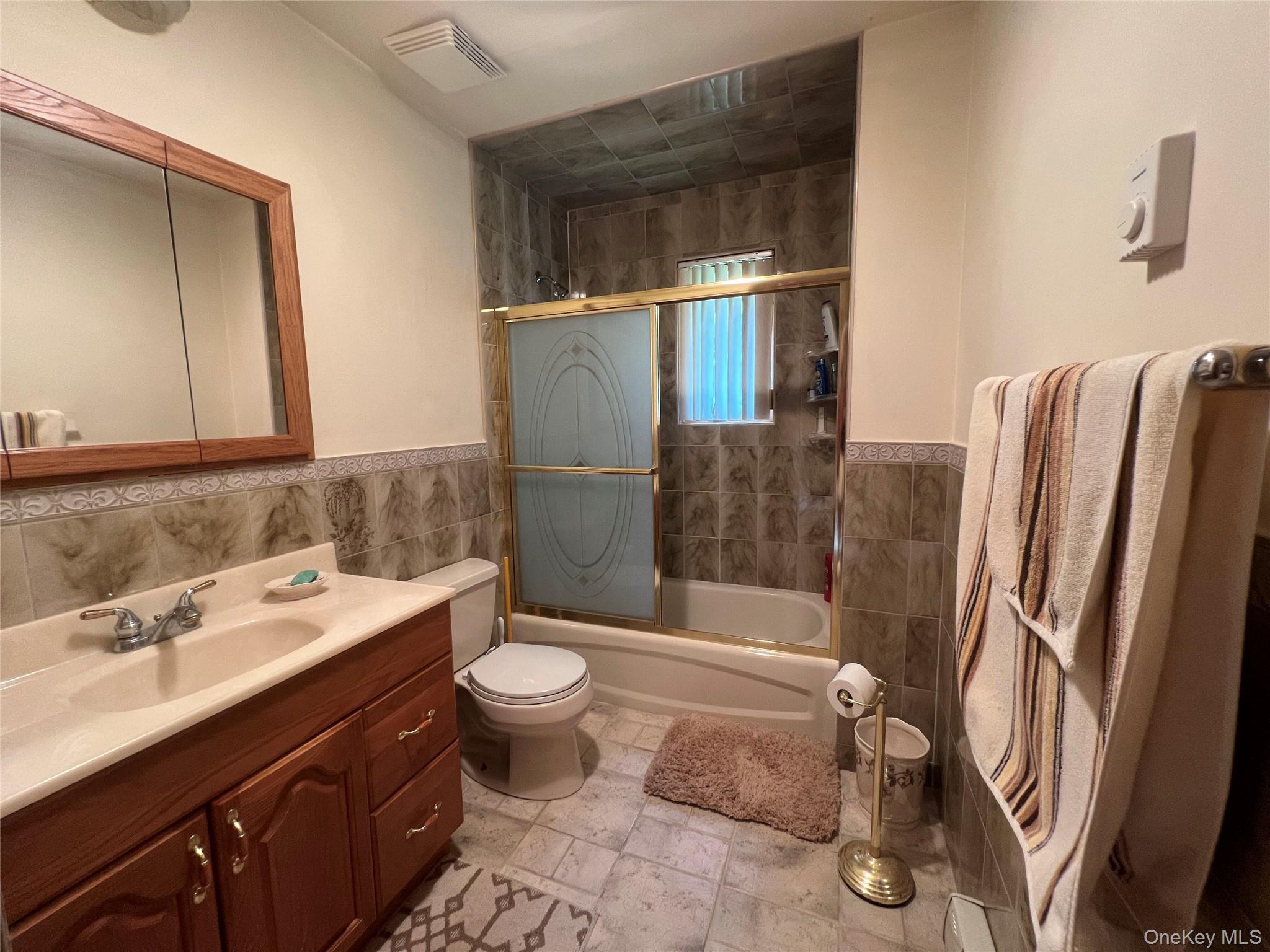 125 Woods Road Barryville, NY 12719 - Photo 11 of 25 a bathroom with a sink toilet and shower