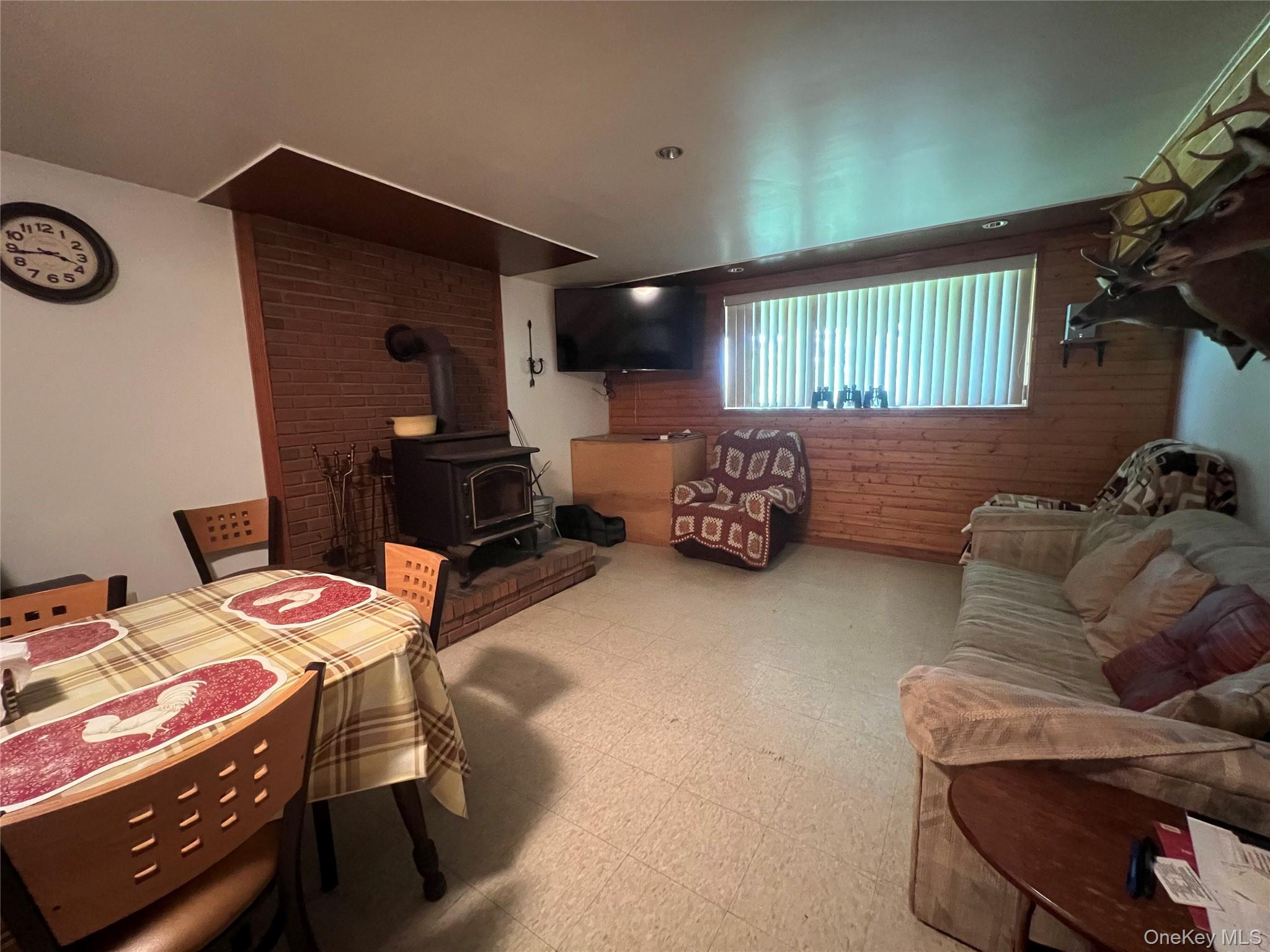 125 Woods Road Barryville, NY 12719 - Photo 15 of 25 a bedroom with furniture and a window