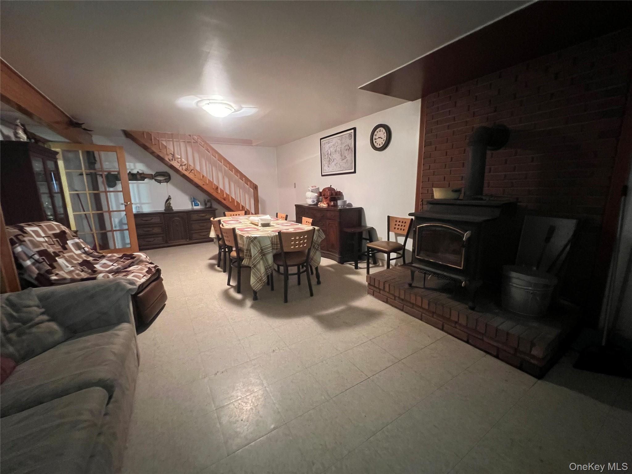 125 Woods Road Barryville, NY 12719 - Photo 16 of 25 a living room with furniture and a flat screen tv