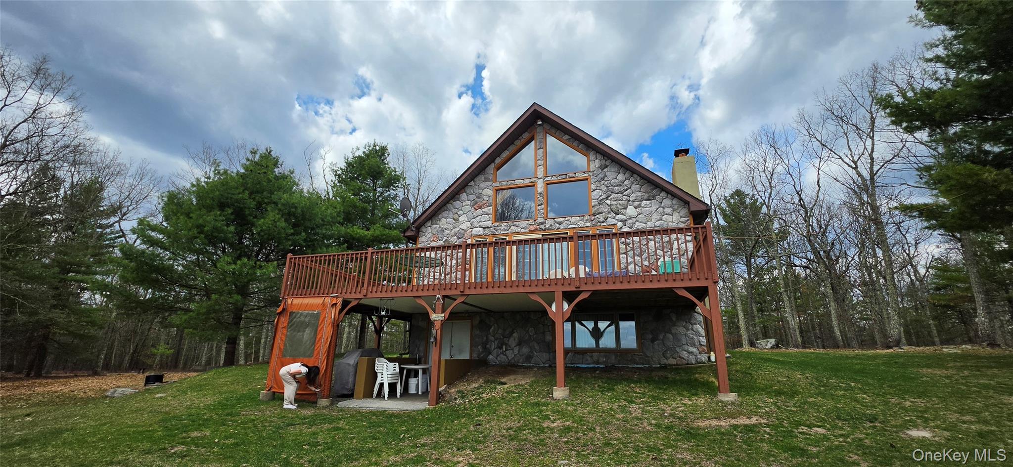125 Woods Road Barryville, NY 12719 - Photo 2 of 34 a view of a house with a yard and deck