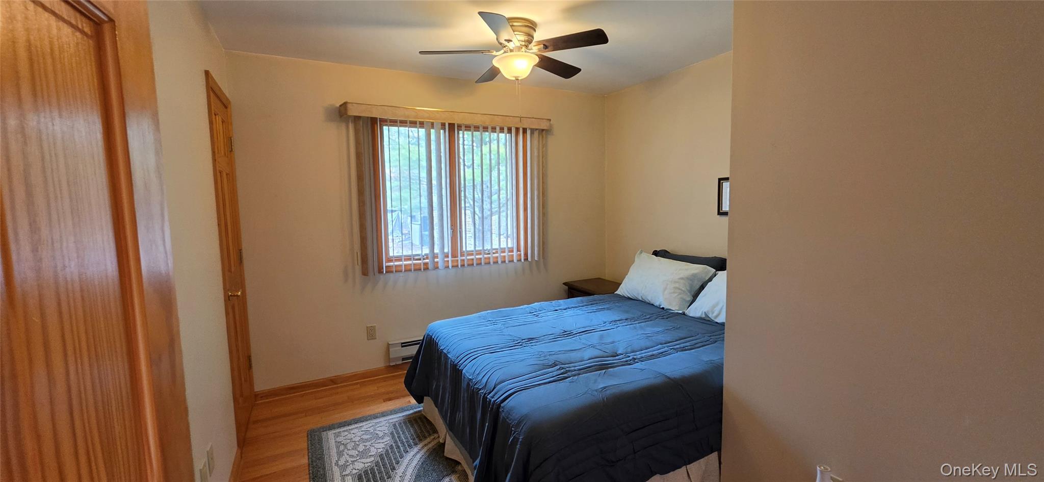 125 Woods Road Barryville, NY 12719 - Photo 22 of 34 a bedroom with a bed and a window