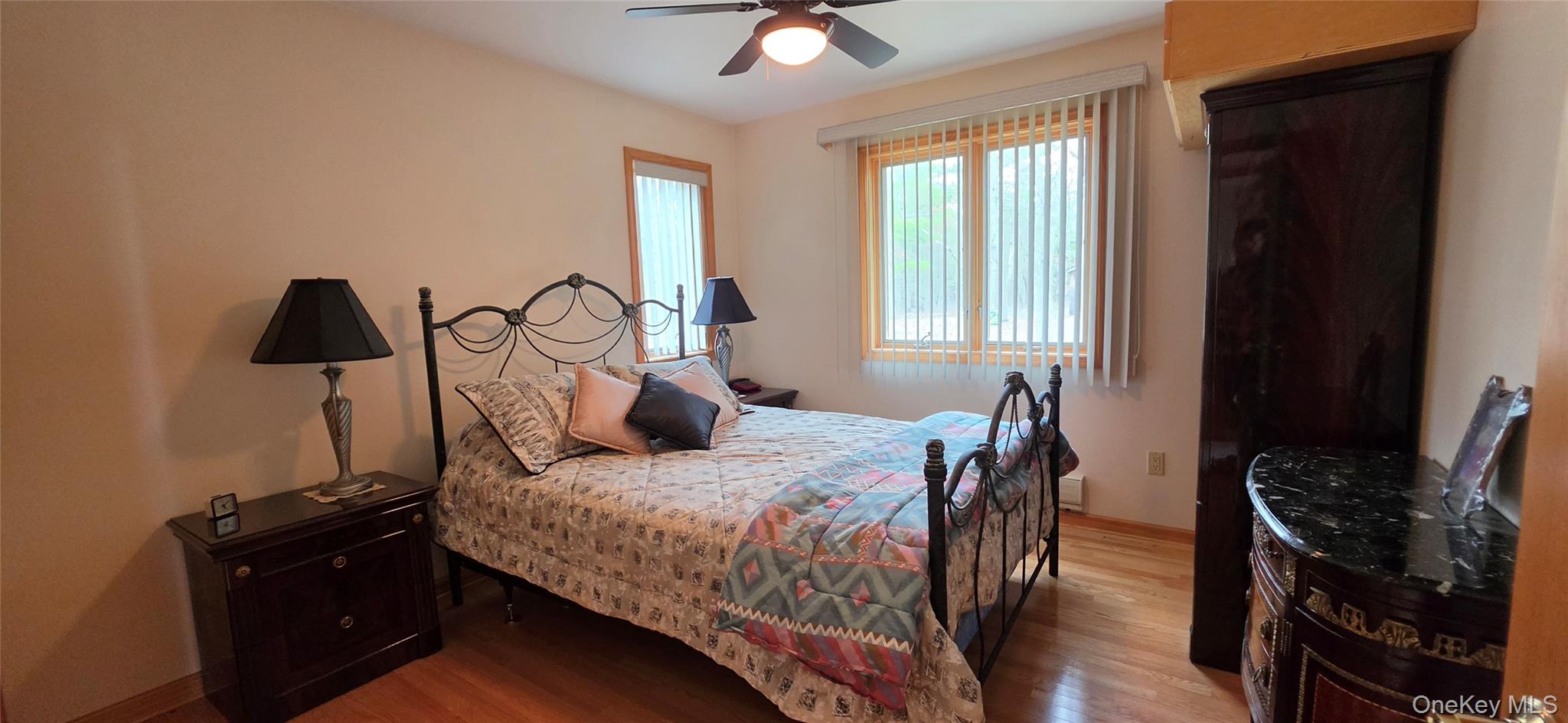 125 Woods Road Barryville, NY 12719 - Photo 23 of 34 a bedroom with a bed and a flat tv screen on the dresser