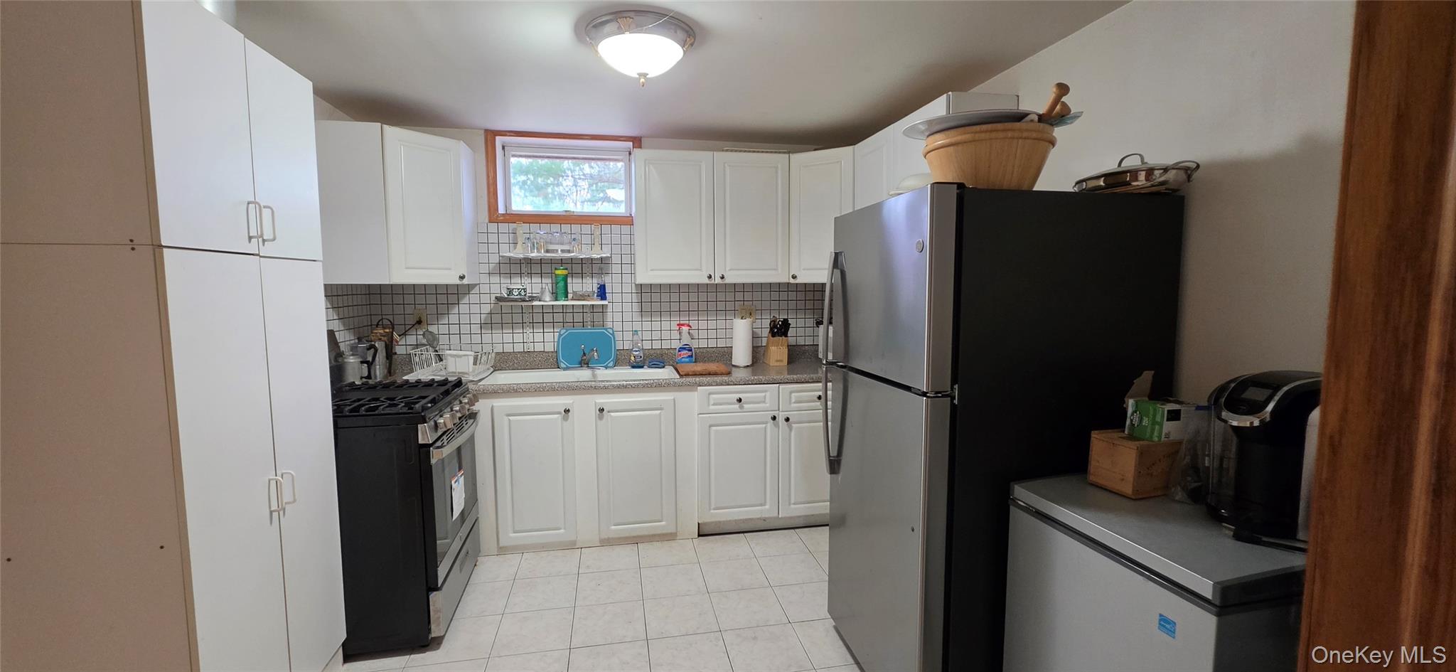 125 Woods Road Barryville, NY 12719 - Photo 28 of 34 a kitchen with a refrigerator stove and sink