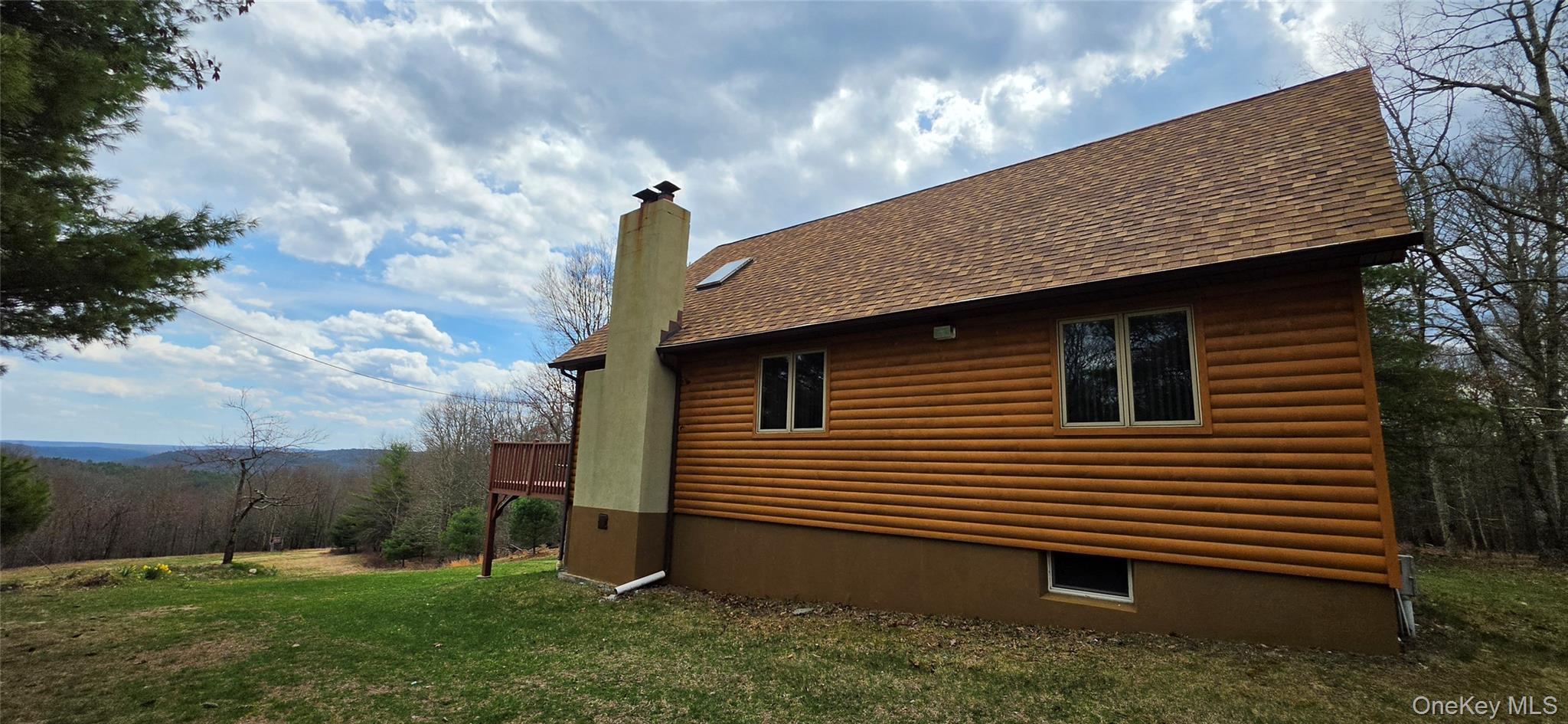 125 Woods Road Barryville, NY 12719 - Photo 3 of 34 a front view of a house with garden