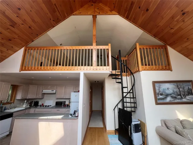 a kitchen with a refrigerator and a sink