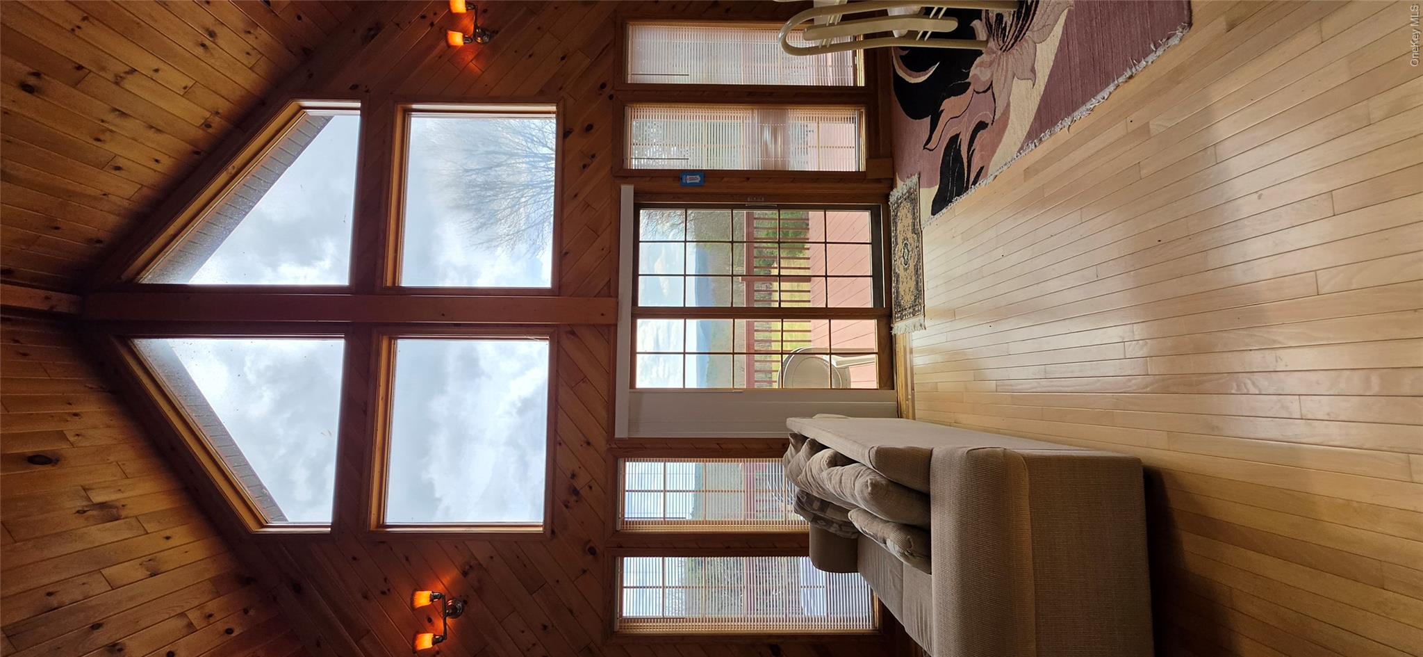 125 Woods Road Barryville, NY 12719 - Photo 9 of 34 a living room with furniture and floor to ceiling windows