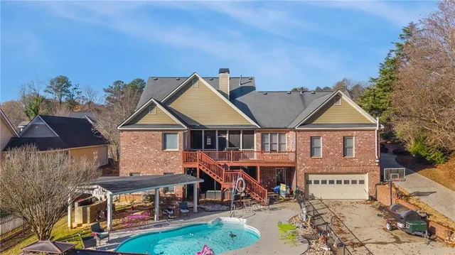a view of a backyard with sitting area
