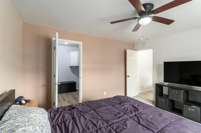 a bathroom with a sink a toilet a mirror and vanity