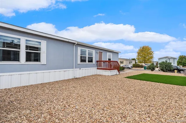 a row of house with outdoor space and wooden fence