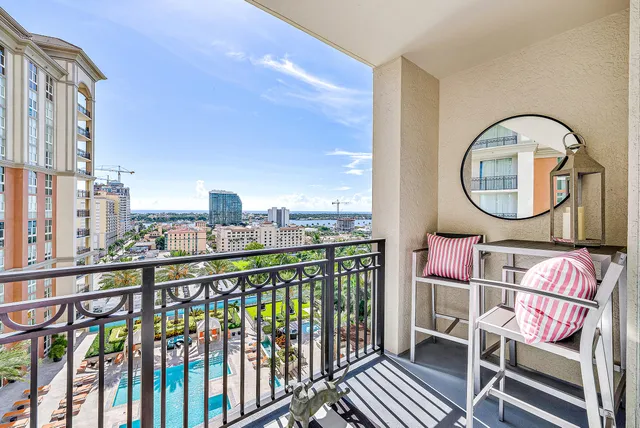 a view of a two chairs in the balcony