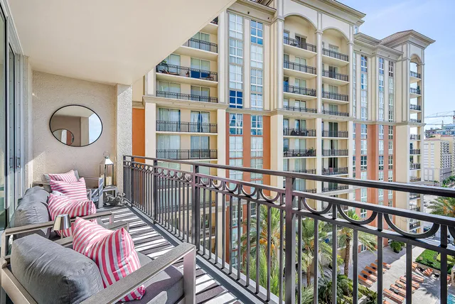 a bedroom with furniture and a large window