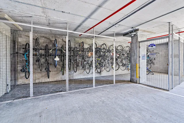 a view of a house with fountain in backyard