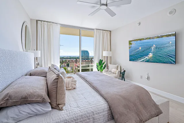 a bed room with a bed and a large window