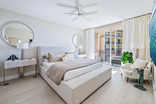 a bed room with a bed and a chair