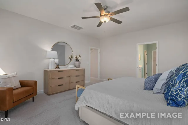 a bedroom with a bed and a dresser