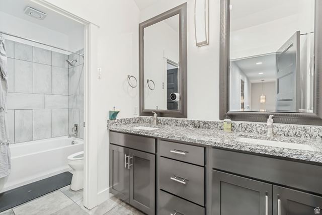 1526 South 500 West Mapleton, UT 84664 - Photo 20 of 54 Bathroom with double vanity, shower / bathtub combination with curtain, and light tile patterned floors