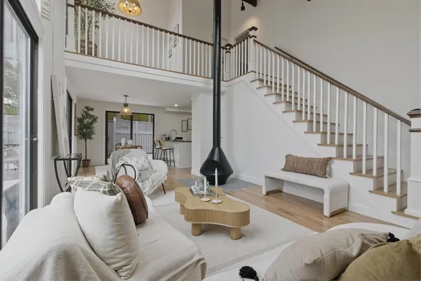 a living room with furniture or couch and a large window