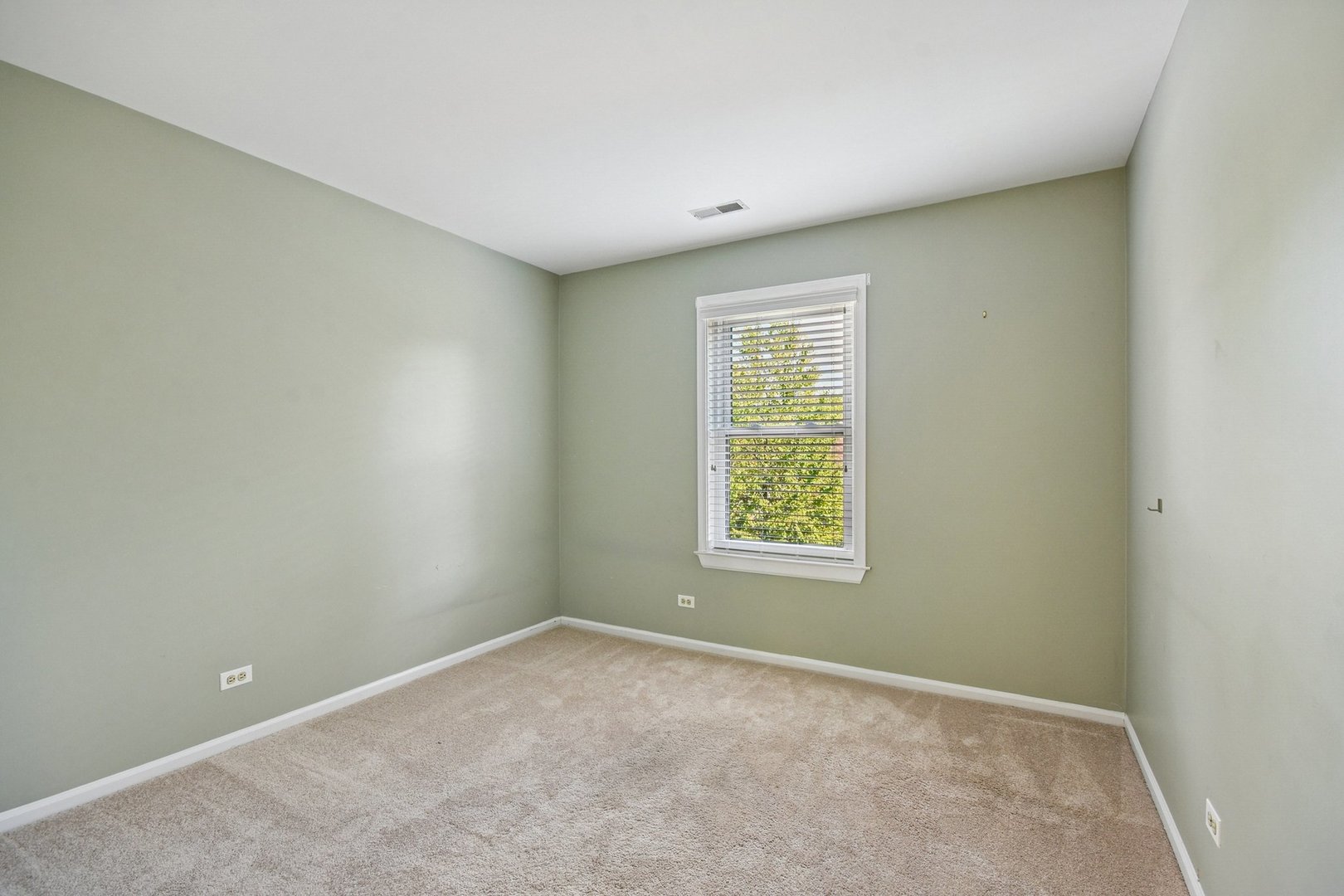 22 Ascot Circle Schaumburg, IL 60194 - Photo 18 of 25 an empty room with a window