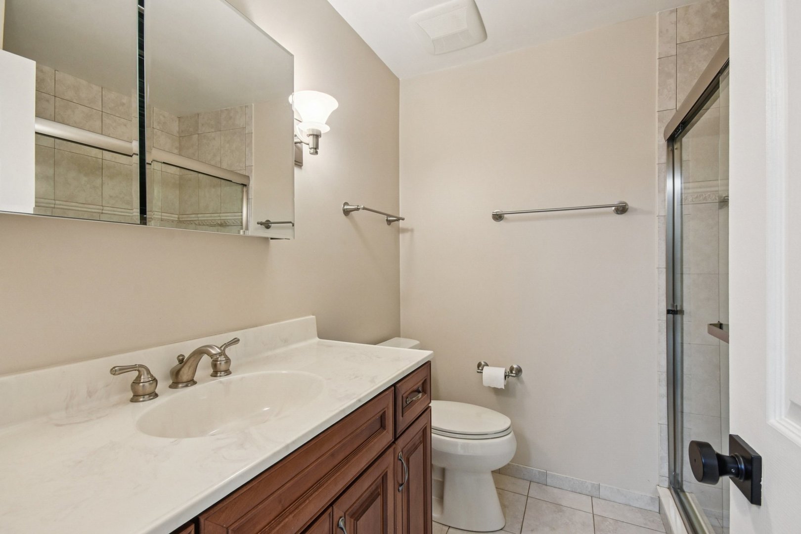 22 Ascot Circle Schaumburg, IL 60194 - Photo 19 of 25 a bathroom with a sink toilet and shower