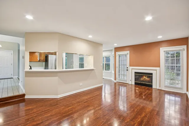 a view of living room with furniture and wooden floor