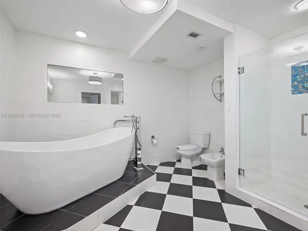 a bathroom with a bathtub and a sink