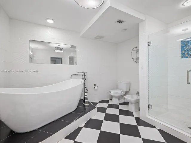 a bathroom with a bathtub and a sink