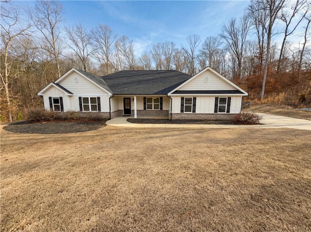 front view of a house with a yard