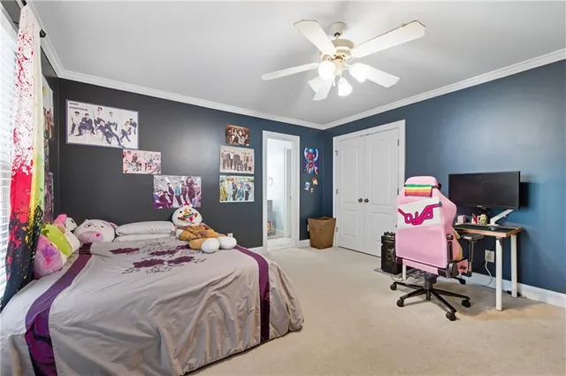 a bedroom with bed a large window and flat screen tv