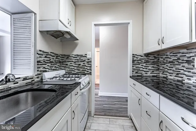 a view of a park with large trees