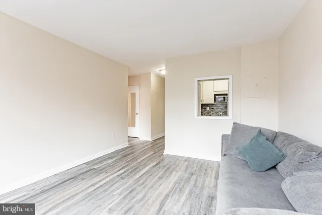 a view of a fence and trees