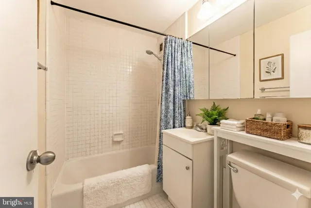 a bathroom with a sink a granite and shower
